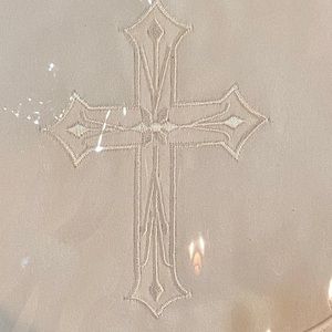Bib with embroidered cross